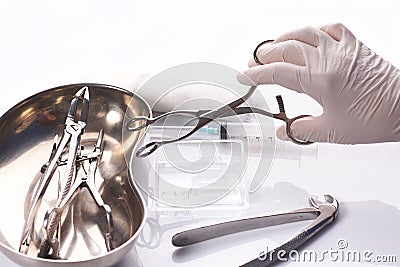 Close up hand dentist is selecting a tool Stock Photo