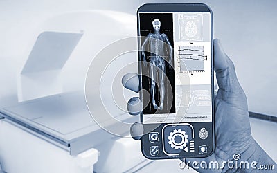 Hand Doctor showing Image of DXA bone density scan on a smartphone in analytics at Hologram human anatomy and skeleton to Stock Photo