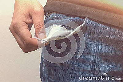 Close up of hand with empty pocket. No money in pocket. Stock Photo