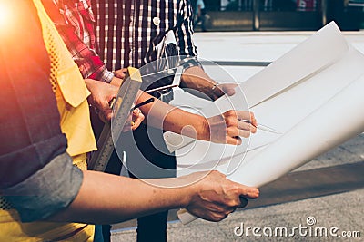 Close up of hand engineer meeting for architectural project working with partner and engineering tools on workplace. Stock Photo