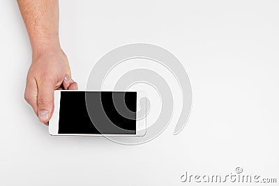 Close up hand hold phone isolated on white, mock-up smartphone white color blank screen Stock Photo