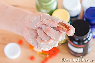 Close up of hand is holding a vitamin supplement Stock Photo