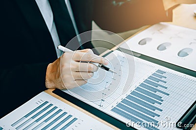 Close up of hand investors are using calculators to calculate the company`s earnings to invest in stocks for future profits Stock Photo