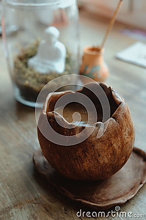 Close-up hand made brown coffee cup and aromatic stick Stock Photo