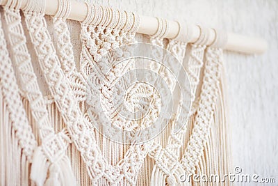 Close-up of hand made macrame texture pattern. ECO friendly modern knitting DIY natural decoration concept in the interior. Flat Stock Photo