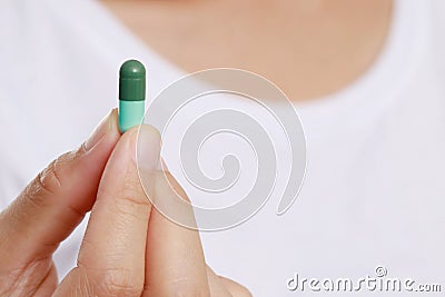 Close up hand man taking multiple pills Stock Photo