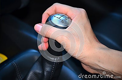 Close up of hand on manual gear shift knob Stock Photo