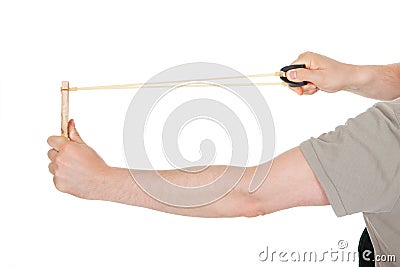 Close-up of hand pulling sling shot Stock Photo