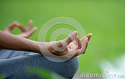 Close up hand senior woman yoga and lotus pose meditation and relax in the nature park Stock Photo