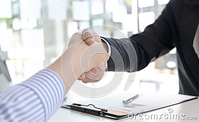 Close-up hand to hand, Congratulations on joining the new employee, Welcome with a handshake, Express their joy in being able to q Stock Photo