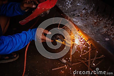 close up hand of welder, craftsman, Industrial Worker welding erecting technical steel Industrial Stock Photo