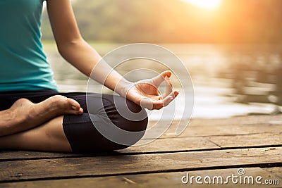 Close up hand. Woman do yoda outdoor. Woman exercising yoga at the nature background. Stock Photo