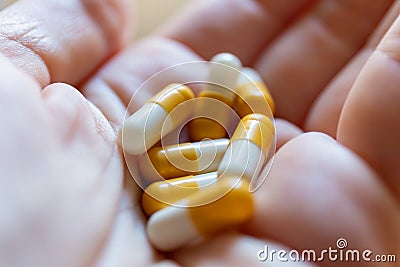 Close up hand of woman overdosing on medication. Stock Photo