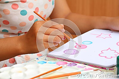 Close up hand women art kid paint watercolor paper Stock Photo