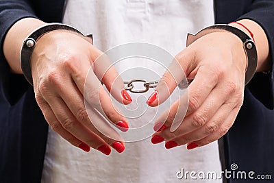 Close-up of handcuffed corrupted female corporate legal concept Stock Photo