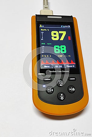 Close up handheld pulse oximeter medical devices use to monitor blood oxygen in patients in emergency room in hospital. Stock Photo