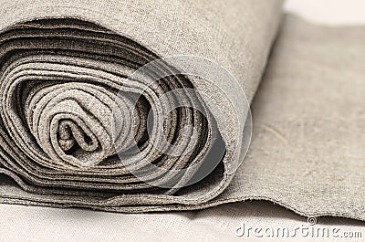 Close up of handmaiden textile canvas in the roll. Homespun hemp unpainted cloth Stock Photo
