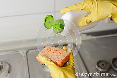 Extruding the detergent onto the sponge, close-up Stock Photo