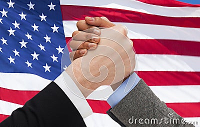 Close up of hands arm wrestling over american flag Stock Photo