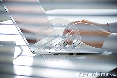 Close-up of hands of business man typing on a laptop. Stock Photo