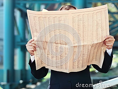 Close up of the hands of the businessman with a newspaper Stock Photo