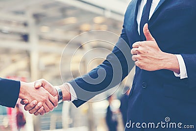 Close up hands businessman and partner working of business people join hand and handshake together and start up work. Stock Photo