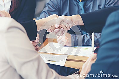 Close up hands businessman and partner working of business people join hand together and start up work. Stock Photo