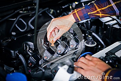 Close up hands checking lube oil level of car engine from deep-s Stock Photo