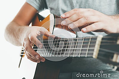 Close-up on the hands of a guitarist playing classical guitar in an unusual technique Stock Photo