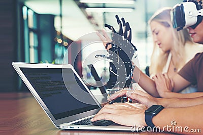 Close up hands man. Group team work programer and engineer working AI robot arm system. Stock Photo