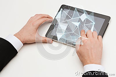 Close up of hands with tablet pc and low poly form Stock Photo