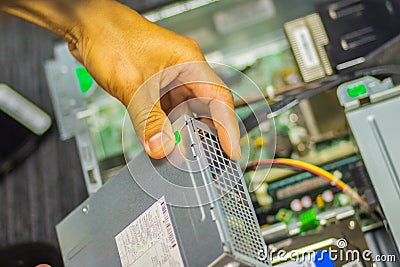 Close up hands of technician during repair desktop computer Stock Photo