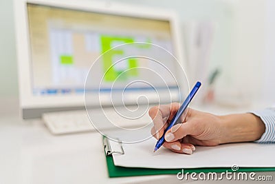 Close-up hands of unrecognizable female doctor general practitioner nurse woman writing treatment prescription medical Stock Photo