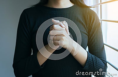 Close up of hand woman in praying position,Female pay respect or put your hands together in a prayer position Stock Photo