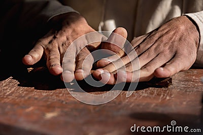 Close-up of hands wrapped from the dry tobacco leaves of a true Cuban cigar. Stock Photo