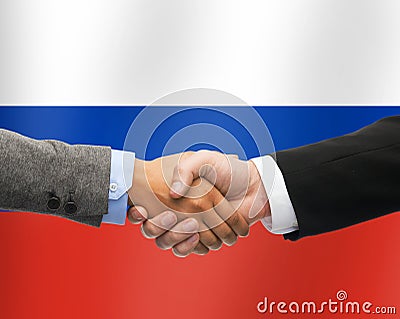 Close up of handshake over russian flag Stock Photo