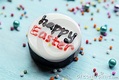 Happy Easter text on a white chocolate Stock Photo