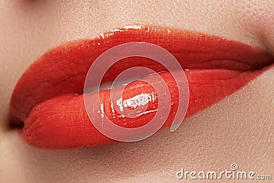 Close-up happy female smile with healthy white teeth, bright red lips make-up. Cosmetology, dentistry and beauty care Stock Photo