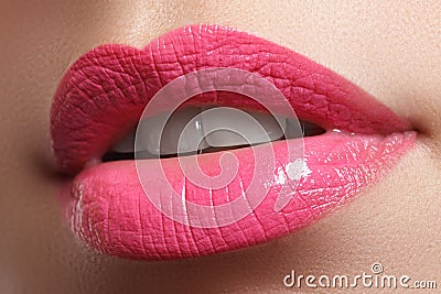 Close-up happy female smile with healthy white teeth, bright red lips make-up. Cosmetology, dentistry and beauty care Stock Photo