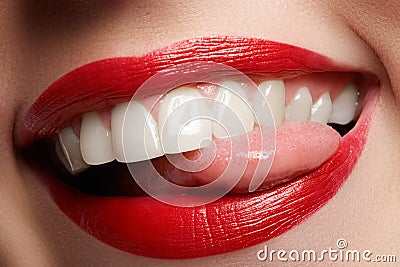 Close-up happy female smile with healthy white teeth, bright red lips make-up Stock Photo