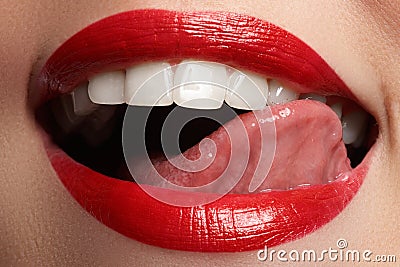 Close-up happy female smile with healthy white teeth, bright red lips make-up Stock Photo