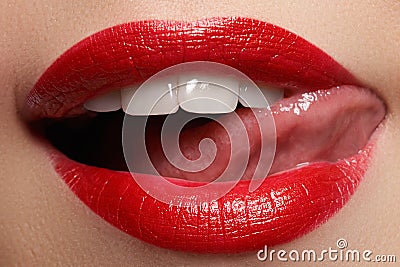 Close-up happy female smile with healthy white teeth, bright red lips make-up Stock Photo