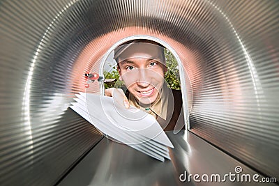 Mailman Placing Envelopes View From Inside The Mailbox Stock Photo