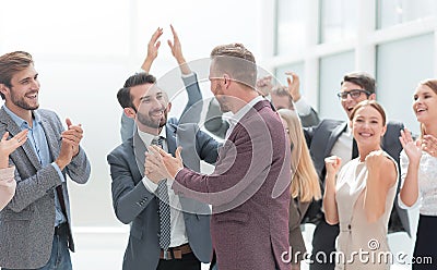 Happy project Manager accepting congratulations of his colleagues Stock Photo