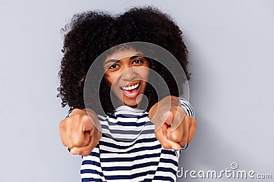 Close up happy young black woman smiling and pointing fingers Stock Photo