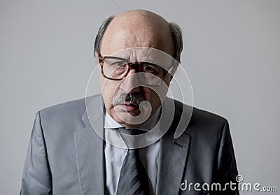 Close up head portrait of bald 60s senior business man sad and depressed looking desperate and feeling low in sadness emotion Stock Photo