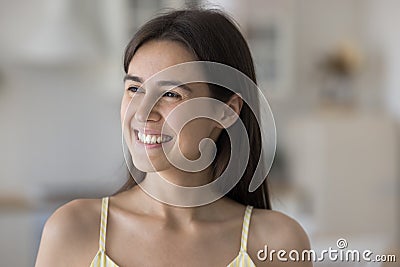 Close up head shot happy beautiful woman staring into distance Stock Photo