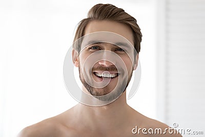 Happy young 30s guy feeling refreshed after showering. Stock Photo