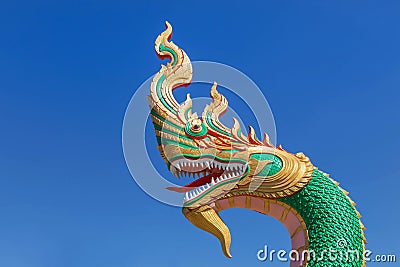 Close up head of thai dragon or serpent king statues in buddhist thai temple on blue sky background Stock Photo