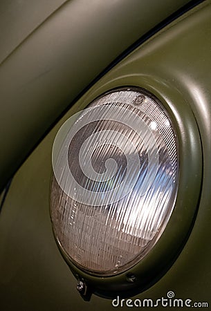Close up of headlight on iconic vintage Volkswagen Beetle car exhibited at the Victoria and Albert Museum exhibition, London UK Editorial Stock Photo